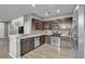 Modern kitchen featuring stainless steel appliances and dark wood cabinetry at 3132 Cartanda Ave, Henderson, NV 89044
