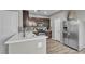 Bright kitchen featuring stainless steel refrigerator and quartz countertops at 3132 Cartanda Ave, Henderson, NV 89044