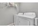Functional laundry area featuring a washer and dryer with storage shelving for added convenience at 3132 Cartanda Ave, Henderson, NV 89044