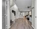 Open-concept living space with hardwood floors, ceiling fan, and a view of the stairs at 3132 Cartanda Ave, Henderson, NV 89044