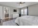 Stylish main bedroom with a mounted television, large bed, dresser and access to bathroom at 3132 Cartanda Ave, Henderson, NV 89044