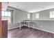 Bright home office with sleek desk, chair, wood floors, and ample natural light at 3132 Cartanda Ave, Henderson, NV 89044