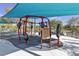 Modern playground equipment with shade cover on a safety-surface, perfect for children to play at 3132 Cartanda Ave, Henderson, NV 89044