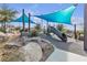 Playground featuring climbing structures and slides under a shade, designed for active outdoor play at 3132 Cartanda Ave, Henderson, NV 89044