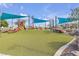 Colorful playground with slides, climbing features, and a soft turf surface for enjoyment at 3132 Cartanda Ave, Henderson, NV 89044