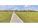 Community soccer field with lush green grass and walking path, ideal for sports and outdoor activities at 3132 Cartanda Ave, Henderson, NV 89044