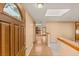 Inviting foyer with hardwood floors and a skylight, leading to the living areas at 3250 Duneville St, Las Vegas, NV 89146