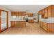 Kitchen features wood cabinets and adjacent breakfast nook at 3250 Duneville St, Las Vegas, NV 89146