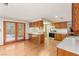 Kitchen with wood cabinets, breakfast bar, stainless steel appliances, and adjacent breakfast nook at 3250 Duneville St, Las Vegas, NV 89146