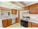 Kitchen with wood cabinets, laminate countertops, and stainless steel appliances at 3250 Duneville St, Las Vegas, NV 89146