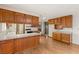 Kitchen features wood cabinets and laminate countertops at 3250 Duneville St, Las Vegas, NV 89146