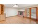 Cozy living room with a brick fireplace, built-in cabinet, and access to the outdoor patio at 3250 Duneville St, Las Vegas, NV 89146