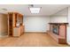 Comfortable living room with a brick fireplace, built-in cabinet, and natural light at 3250 Duneville St, Las Vegas, NV 89146