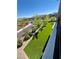 Artificial turf backyard, with a common area adjacent to the house at 438 Wind Poppy St, Las Vegas, NV 89138