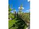 Backyard with artifical turf, mature landscaping, and a modern playground at 438 Wind Poppy St, Las Vegas, NV 89138