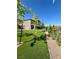 Beautifully maintained yard with new trees and shrubs, and artificial turf at 438 Wind Poppy St, Las Vegas, NV 89138