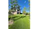 Manicured backyard with artificial turf offers a lush green space for outdoor activities at 438 Wind Poppy St, Las Vegas, NV 89138
