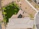 Aerial view of a well-manicured backyard featuring a play area and a trampoline at 438 Wind Poppy St, Las Vegas, NV 89138