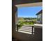 Balcony view showcasing the artificial turf backyard and a charming playground at 438 Wind Poppy St, Las Vegas, NV 89138