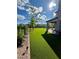 The spacious backyard boasts pristine artifical turf, mature landscaping and privacy shrubs at 438 Wind Poppy St, Las Vegas, NV 89138