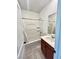 Cozy bathroom featuring a shower-tub combo and a single sink vanity with a wood cabinet at 438 Wind Poppy St, Las Vegas, NV 89138