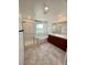 Bright bathroom featuring a shower, soaking tub and a double sink vanity with dark wood cabinets at 438 Wind Poppy St, Las Vegas, NV 89138