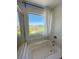Bright bathroom bathtub with views of the neighborhood at 438 Wind Poppy St, Las Vegas, NV 89138