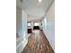 Open concept living space with wood-look flooring and natural light at 438 Wind Poppy St, Las Vegas, NV 89138
