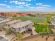 Aerial view of a single-Gathering home across from a school, featuring a well-manicured backyard at 438 Wind Poppy St, Las Vegas, NV 89138