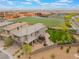 Aerial view of a single-Gathering home across from a school, featuring a play area and a trampoline at 438 Wind Poppy St, Las Vegas, NV 89138