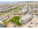 Aerial view of a single-Gathering home featuring a well-manicured lawn, play area, and neighborhood at 438 Wind Poppy St, Las Vegas, NV 89138