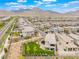 View of single-Gathering home with a manicured backyard, swing set, trampoline, mountain views, and neighborhood at 438 Wind Poppy St, Las Vegas, NV 89138
