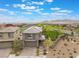 Aerial view of a single-Gathering home, featuring a well-manicured lawn and is located near a school at 438 Wind Poppy St, Las Vegas, NV 89138