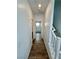 Bright hallway with hardwood flooring leading to additional rooms and staircase at 438 Wind Poppy St, Las Vegas, NV 89138