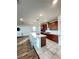 Spacious kitchen island with seating area, stainless steel appliances, tile floor and modern finishes at 438 Wind Poppy St, Las Vegas, NV 89138