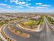 Scenic community streets with landscaping, offering access to homes and a tranquil neighborhood park at 438 Wind Poppy St, Las Vegas, NV 89138