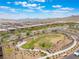A serene suburban neighborhood featuring beautiful landscaped areas and desert-friendly plantings and walking paths at 438 Wind Poppy St, Las Vegas, NV 89138