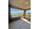 Open patio with iron railing, boasting scenic views of mountains and a grassy common area at 438 Wind Poppy St, Las Vegas, NV 89138
