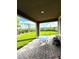 Relaxing patio area with a table overlooking the landscaped backyard at 438 Wind Poppy St, Las Vegas, NV 89138
