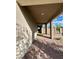 Covered walkway and porch with brick pavers lead to the front door and backyard gate at 438 Wind Poppy St, Las Vegas, NV 89138