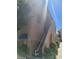 Two-story condo exterior with stairs leading to upper units and well-manicured landscaping at 4720 Obannon Dr # D, Las Vegas, NV 89102