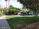 Community pool area with lush landscaping and seating at 4720 Obannon Dr # D, Las Vegas, NV 89102