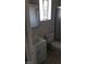 Compact bathroom with white vanity, toilet, and tiled floors, designed for functionality at 4770 Topaz St # 79, Las Vegas, NV 89121