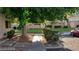 Charming front yard with green lawn, mature trees, and landscaping in a residential neighborhood at 4770 Topaz St # 79, Las Vegas, NV 89121