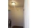 Hallway features modern wood-look floors, and updated lighting creating a warm and inviting space at 4770 Topaz St # 79, Las Vegas, NV 89121