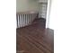Upper-level landing area with wood-look floors, shelving, and room access at 4770 Topaz St # 79, Las Vegas, NV 89121