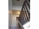 A well-lit staircase with wooden handrails provides access to upper level storage at 4770 Topaz St # 79, Las Vegas, NV 89121