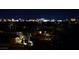 A night time view features a cityscape with towering buildings and vibrant city lights at 5030 Spanish Hills Dr, Las Vegas, NV 89148