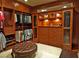 Spacious walk-in closet with custom wood cabinetry and ample storage space for clothes and accessories at 5030 Spanish Hills Dr, Las Vegas, NV 89148