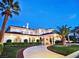 Stunning home boasts palm trees, arched windows, and a circular driveway at 5030 Spanish Hills Dr, Las Vegas, NV 89148